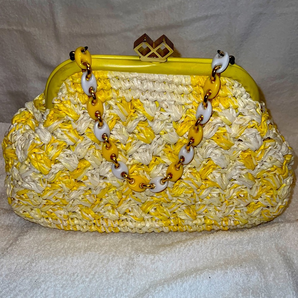 Elegant hand crafted material straw bag. Inside is clean. Great condition.